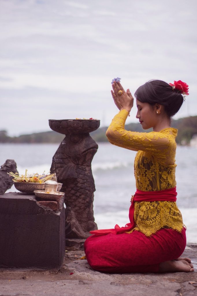 Balinese woman praying